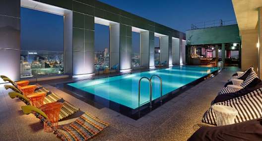 a swimming pool on the top of a building