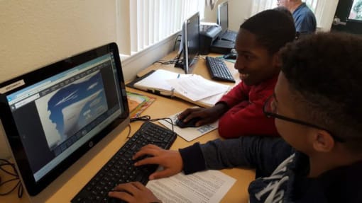 Youth residents use a computer lab