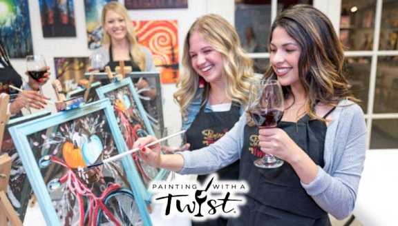 Three women painting and drinking wine.