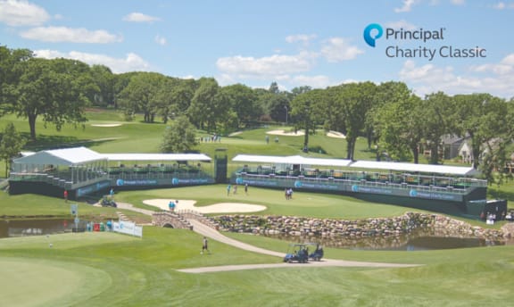 A golf course with a large banner that says Principal Charity Classic.
