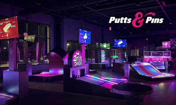 A bowling alley with Putts & Pins signage.