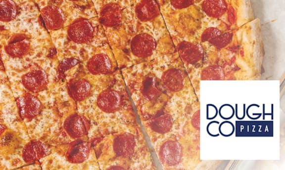 A pepperoni pizza with a slice missing from it.
