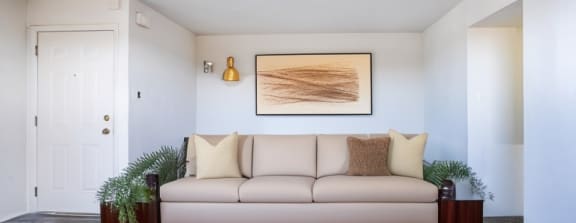 a living room with a couch and a coffee table