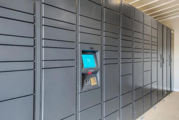 a row of gray lockers with a screen on the side