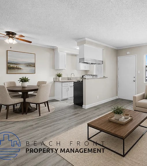 A well-lit, modern kitchen and living room with a dining area.