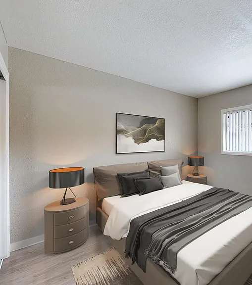 A well-lit bedroom with a large bed and a painting on the wall.