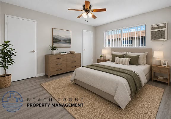 A bedroom with a bed, dresser, and ceiling fan.