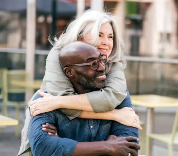 a man and a woman hugging