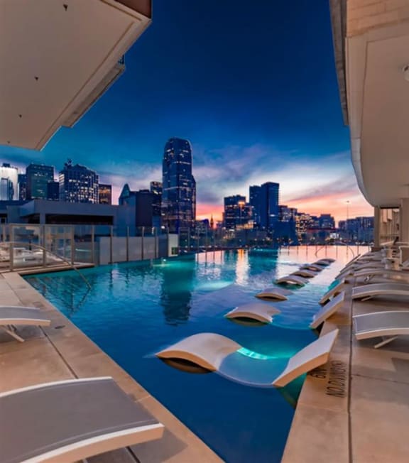 infinity edge pool with Dallas skyline views at The Gabriella apartments