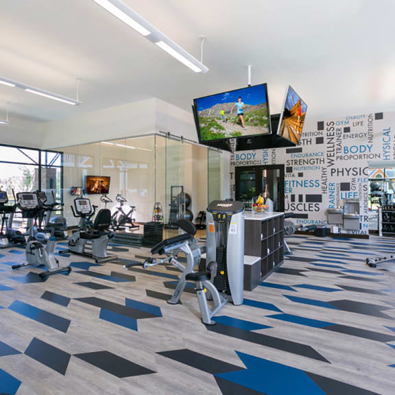 three women walking down the street with shopping bags