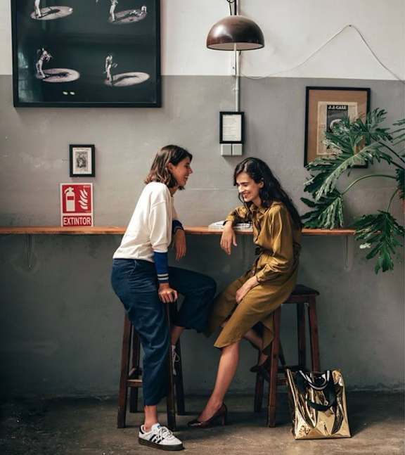 Two women sitting at a table at Emporium House Apartments, Reading