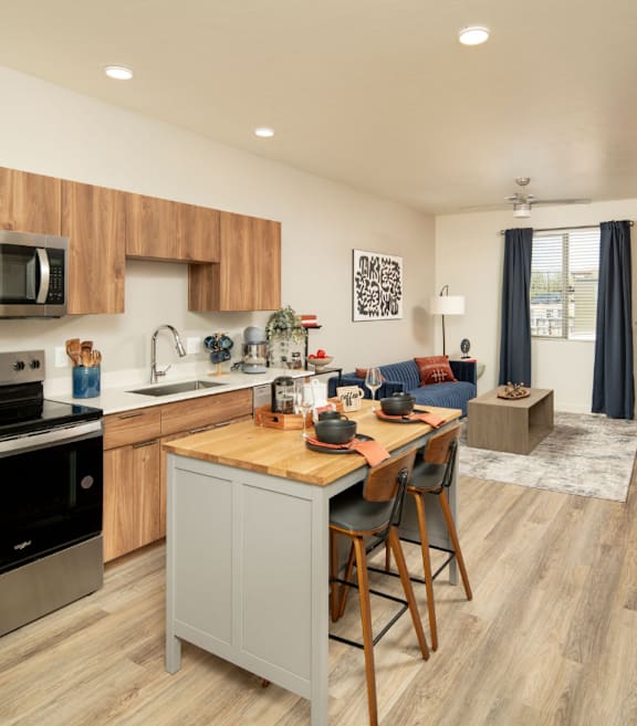 Villa Cielo Cortaro Apartments in Tucson, Arizona Model Kitchen with Island and Living Room