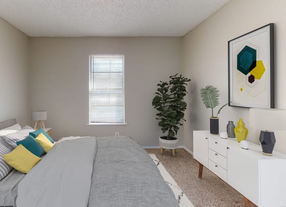 Carpeted bedroom with window