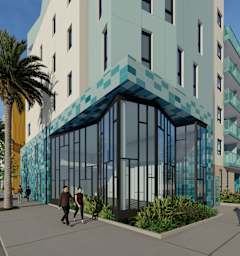 A modern building with a blue glass facade is depicted in the image.