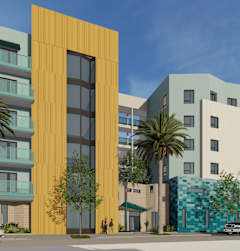 A modern building with a yellow door stands out among other buildings.