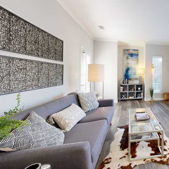 a living room with a couch and a tv at Dwell at Naperville, Naperville, IL, 60563