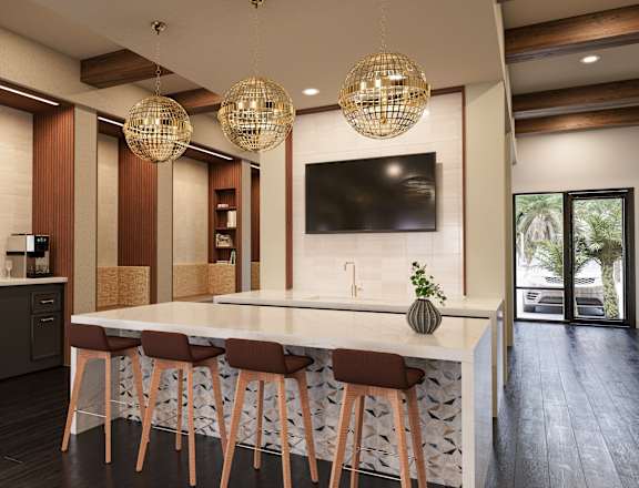 A modern kitchen with a bar area and a television mounted on the wall.