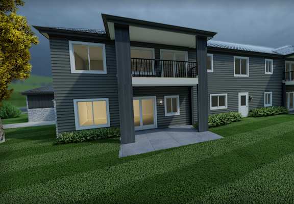 A modern apartment building with a balcony on the second floor.