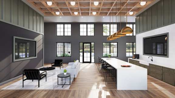 A modern living room with a long white sofa and a black chair. at Wrenley Luxury Apartment Homes, Newnan, 30265