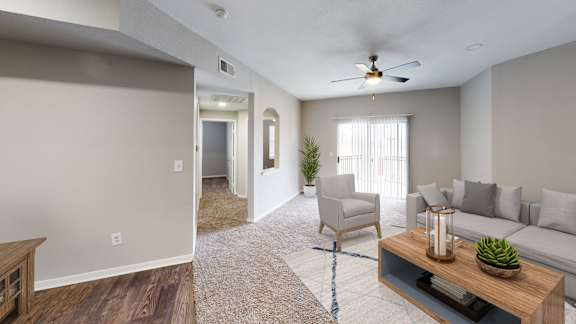 an open living room and dining room with a couch and a table at The Legends at Eagle Mountain Lake, Fort Worth, Texas