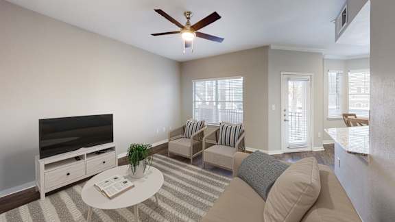 a living room with a couch and a tv at The Legends at Eagle Mountain Lake, Fort Worth, TX, 76179