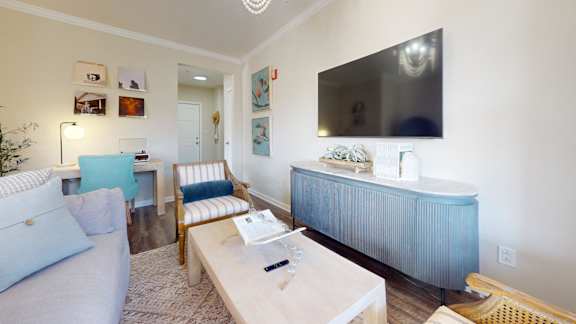 a bedroom with a bed and a ceiling fan
