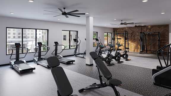 A gym with a variety of equipment including treadmills, stationary bikes, and weight machines. at Refinery at Pointe17 Apartments, Phoenix, AZ, 85085