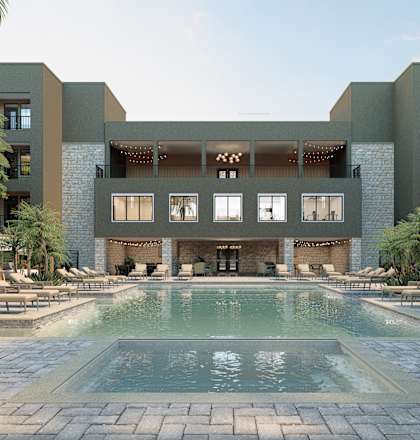 A modern building with a pool in front. at Refinery at Pointe17 Apartments, Phoenix, AZ, 85085