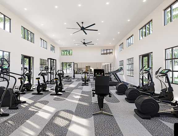 A gym with a variety of equipment including treadmills, stationary bikes, and weight machines at Verity Luxury Apartment Homes Apartments, FL, 32960