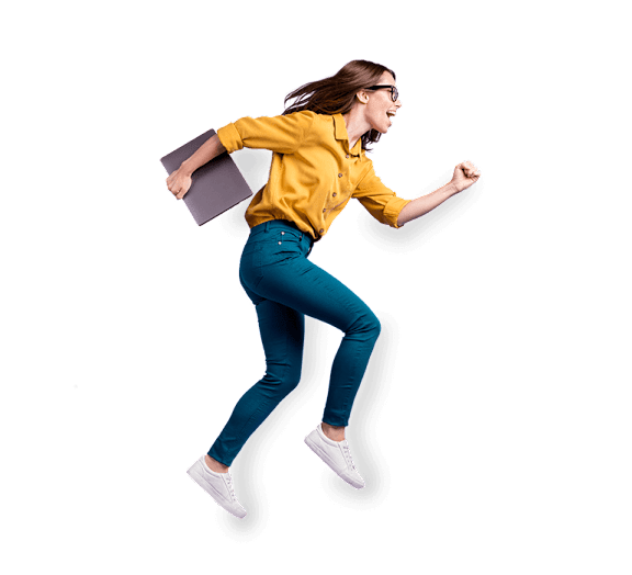 A woman in a yellow shirt and blue jeans is jumping with a book in her hand.