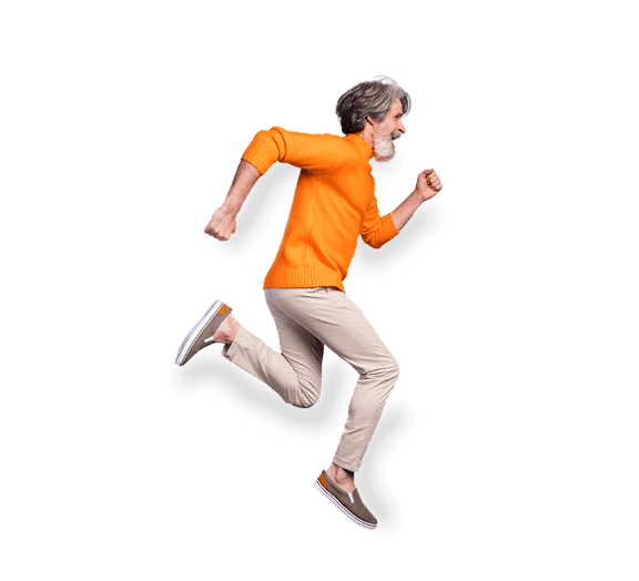 A man in an orange shirt and beige pants is running.