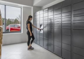 a woman in a black shirt is opening a drawer