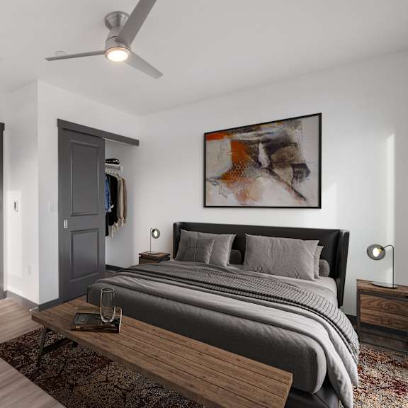 a bedroom with a large bed and ceiling fan  at Elevation16 Apartments, Washington