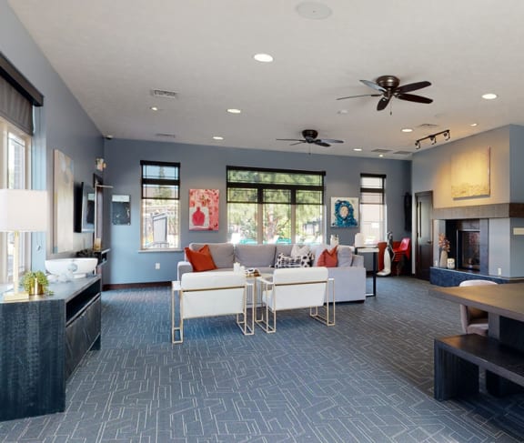 a large living room with a fireplace and a dining table