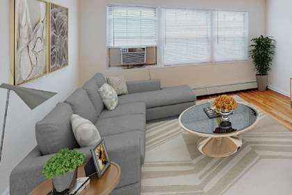 a living room with a gray couch and a coffee table