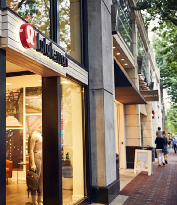 a store front of a clothing store on a city street