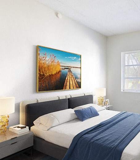 a bedroom with a bed and a tv