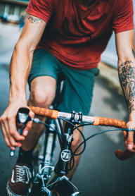 Man Wearing Sneakers Riding Bike at Ironside Apartments, Spokane , WA 99202