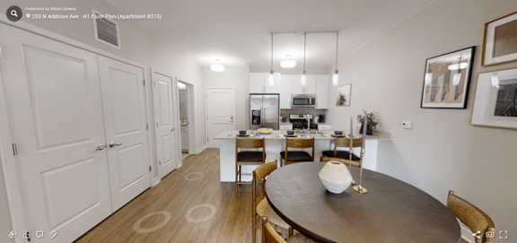 A dining room with a table and chairs is shown.