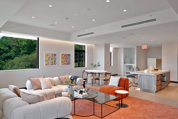 a rendering of a living room with tables and chairs  at Riello Apartments Owner LLC, New Jersey, 07020