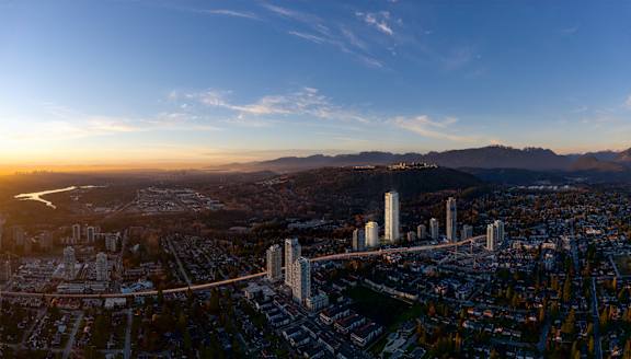 an aerial view of the city at sunset