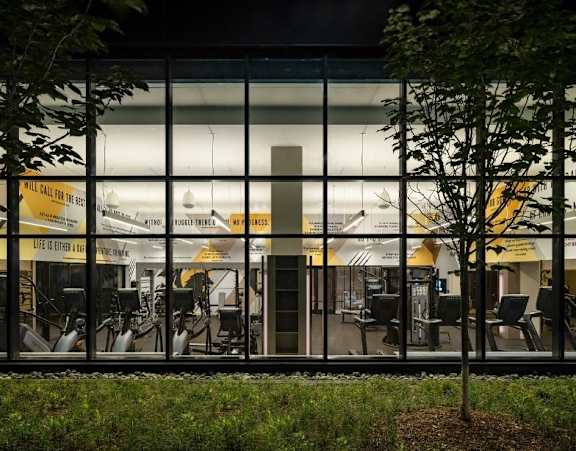 A gym with a sign that says "Life is either an adventure or a mistake".
