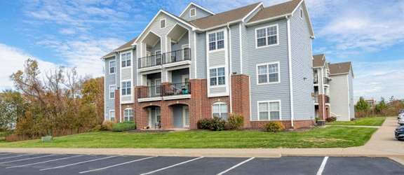 spacious parking lot in front of an apartment building