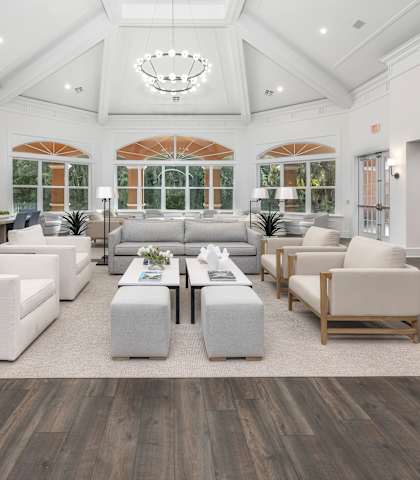 a large living room with couches and tables