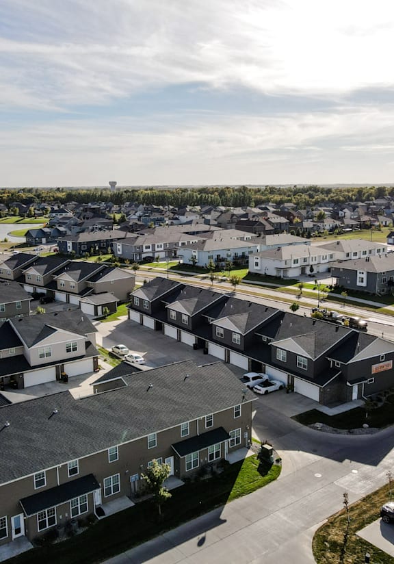 A bird's eye view of a residential area with houses and apartment buildings.