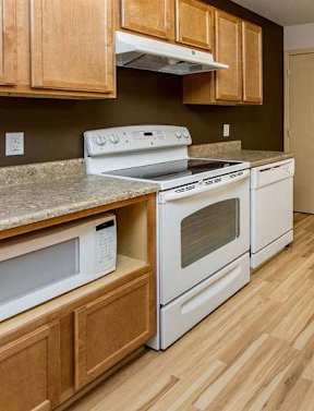 Kitchen with wooden closet at Cedarbrooke Place , Norwalk, IA, Iowa