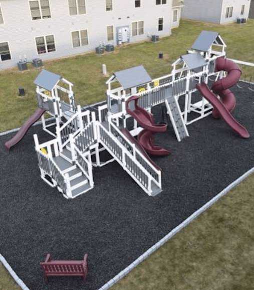 an aerial view of a playground with slides