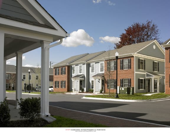 a rendering of a row of town houses on a street