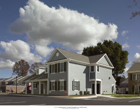 a rendering of an apartment building on the corner of a street