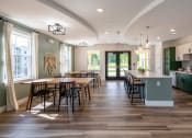 Thumbnail 21 of 33 - a clubroom kitchen with a large table and chairs at Edgebrook Residences, Merrimack